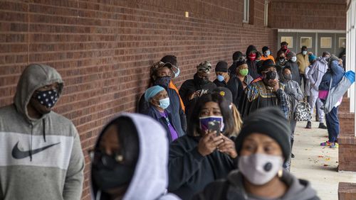 Fulton County residents wait in line in 2020 to cast ballots during early voting at the C.T. Martin Natatorium and Recreation Center near the Westhaven neighborhood in Atlanta. (Alyssa Pointer/The Atlanta Journal-Constitution)