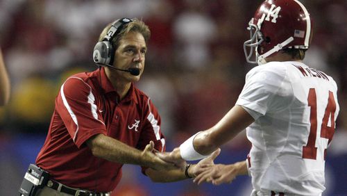 Alabama head coach Nick Saban greets quarterback John Parker Wilson (14) after a field goal in the fourth quarter in their 34-10 in the Chick-fil-A College Kickoff game Aug. 30, 2008, at the Georgia Dome in Atlanta.