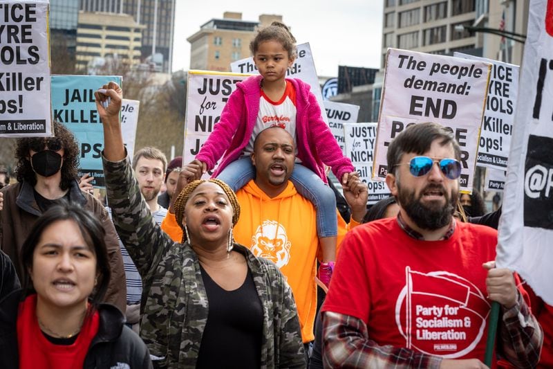 A crowd marched in downtown Atlanta on Jan. 28, 2023, to protest the killing of Tyre Nichols, who died after been attacked by five by Memphis police. The officers were fired and charged with murder, aggravated assault, aggravated kidnapping, official misconduct and official oppression. (Arvin Temkar/The Atlanta Journal-Constitution)