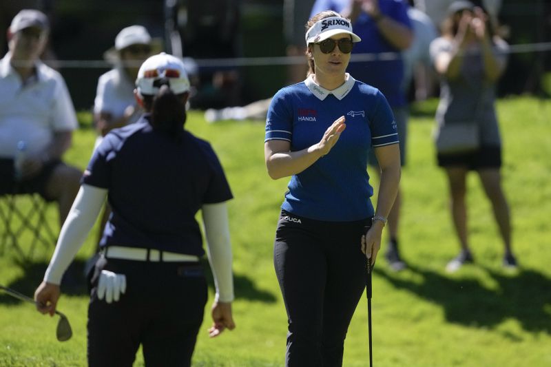 Hannah Green, of Australia, reacts after making her putt on the 16th hole during the first round of the Women's PGA Championship golf tournament at Sahalee Country Club, Thursday, June 20, 2024, in Sammamish, Wash. (AP Photo/Gerald Herbert)