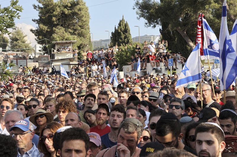 Mourners attend the funeral of Israeli-American hostage Hersh Goldberg-Polin, who was killed in Hamas captivity in the Gaza Strip, in Jerusalem, Monday, Sept. 2, 2024. (Gil Cohen-Magen/Pool via AP)