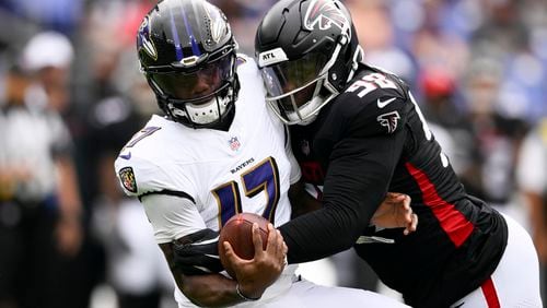 Baltimore Ravens quarterback Josh Johnson is sacked by Atlanta Falcons defensive tackle Ruke Orhorhoro during the first half of a preseason NFL football game on Saturday, Aug. 17, 2024, in Baltimore. (AP Photo/Nick Wass)