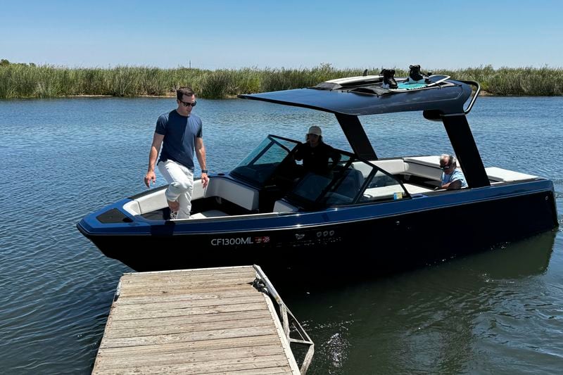 Mitch Lee, co-founder and CEO of Arc Boats, steps off an Arc Sport, an electric boat made by his California company, in the Sacramento-San Joaquin Delta near Bethel Island, Calif. on July 31, 2024. (AP Photo/Terry Chea)