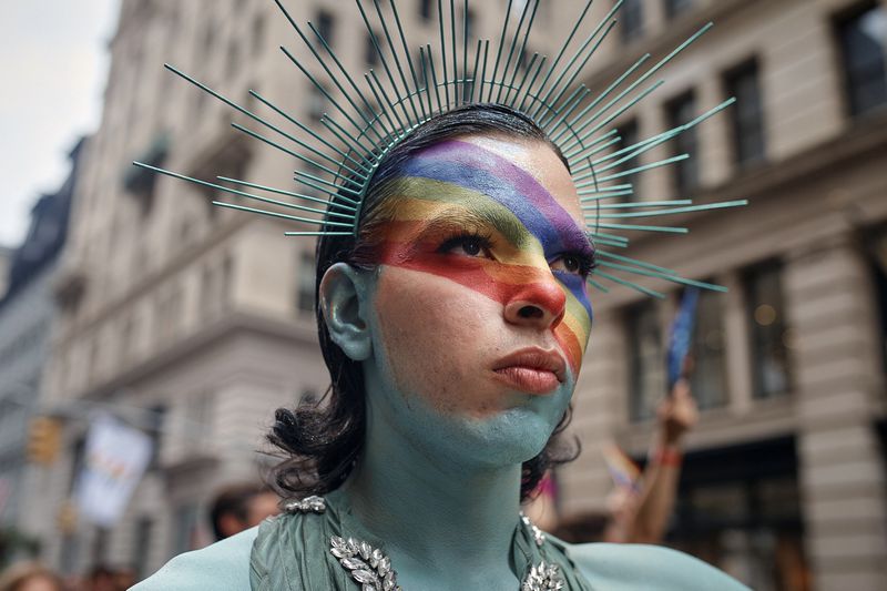 A reveler performs during the NYC Pride March, Sunday, June 30, 2024, in New York. (AP Photo/Andres Kudacki)