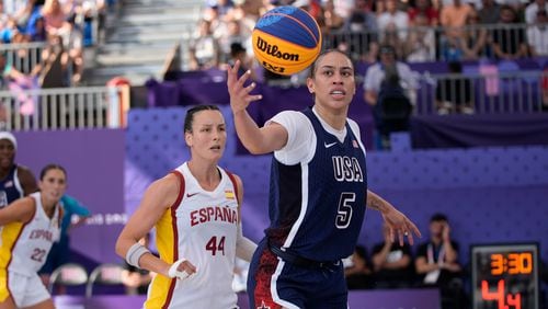 United States' Dearica Hamby (5) rebounds as Spain's Gracia Alonso (44) defend sduring a women's 3x3 basketball semifinal game at the 2024 Summer Olympics, Monday, Aug. 5, 2024, in Paris, France. (AP Photo/Frank Franklin II)