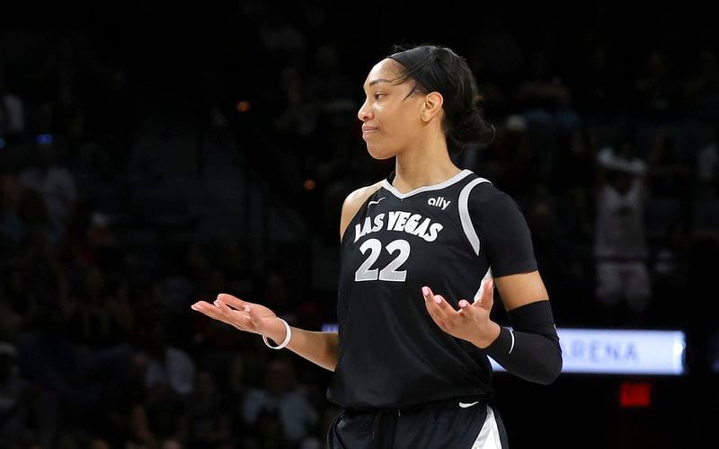 Las Vegas Aces center A'ja Wilson reacts after making a basket against the Atlanta Dream during the first half of a WNBA basketball game Friday, Aug. 30, 2024, in Las Vegas. (Steve Marcus/Las Vegas Sun via AP)