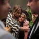 Autumn Nelon, (right), hugs her family friend during the Nelon family funeral service at Roopville Road Baptist Church in Roopville on Aug. 6. The Atlanta-based family gospel group  - Jason Clark and Kelly Nelon Clark, and their daughter, Amber Nelon Kistler - died in a plane crash July 26. Their lives and legacy were honored at a service on Tuesday. (Images by Ziyu Julian Zhu / For the AJC)