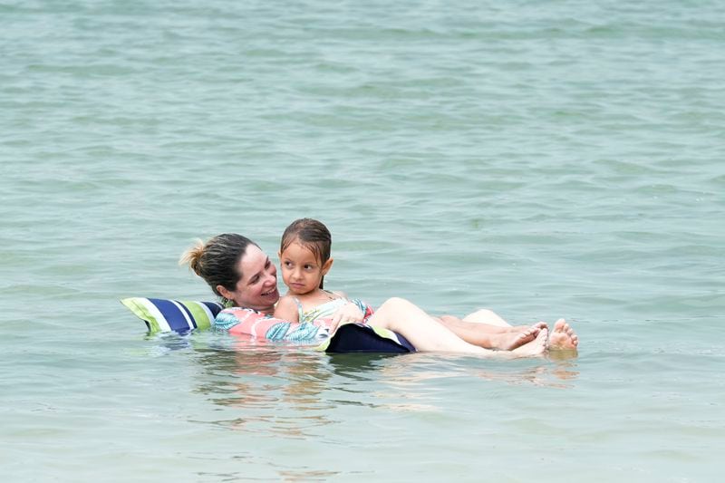 Bathers enjoy the warm water at Oleta River State Park, Thursday, Aug. 22, 2024, in North Miami Beach, Fla. (AP Photo/Marta Lavandier)