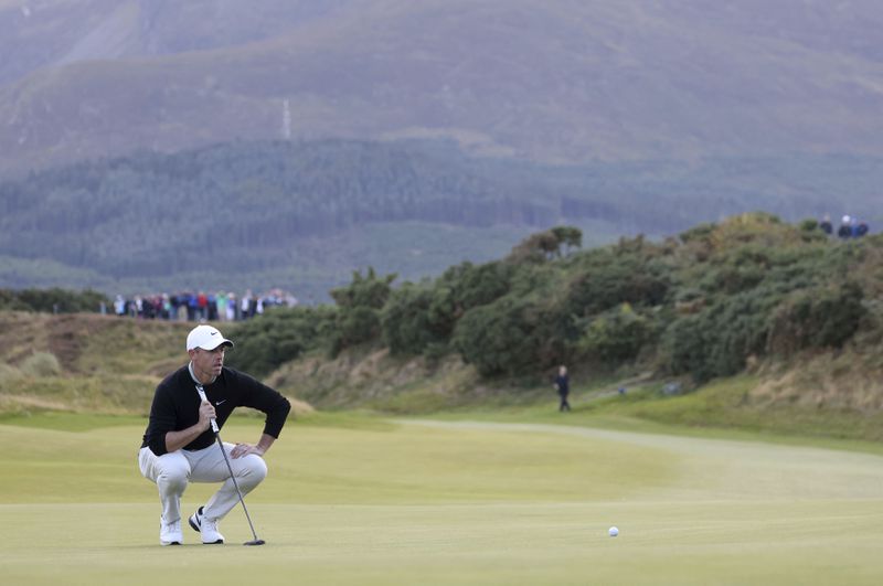 Northern Ireland's Rory McIlroy lines up a putt on the thirteenth green during day four of the Amgen Irish Open 2024 at Royal County Down in Newcastle, County Down, England, Sunday Sept. 15, 2024. (Peter Morrison/PA via AP)