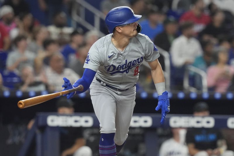 Los Angeles Dodgers' Teoscar Hernández (37) hits a three-run home run during the fourth inning of a baseball game against the Miami Marlins, Wednesday, Sept. 18, 2024, in Miami. (AP Photo/Marta Lavandier)