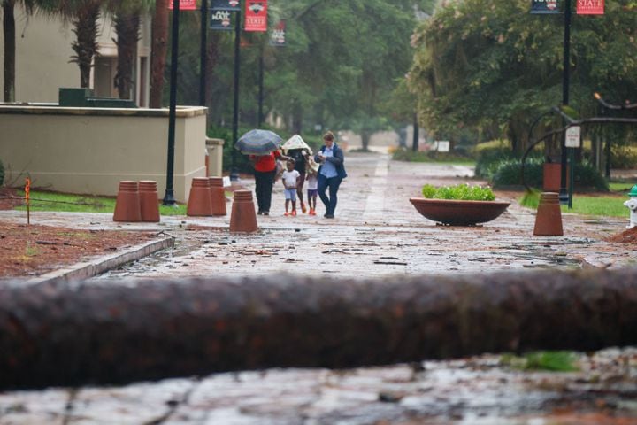 People were seen walking through the Valdosta State University campus on Monday, August 5, 2024, in the aftermath of Hurricane Debby.
(Miguel Martinez / AJC)