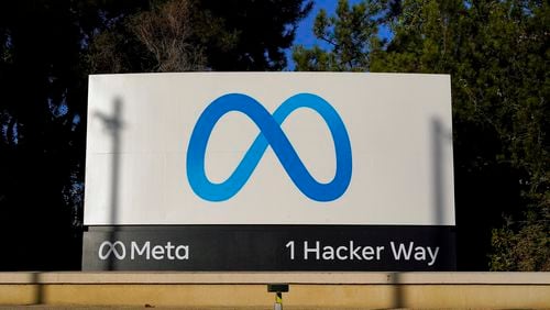 FILE - Meta's logo is seen on a sign at the company's headquarters in Menlo Park, Calif., Nov. 9, 2022. Meta has agreed to a $1.4 billion settlement with Texas in a privacy lawsuit over claims that the tech giant used biometric data of users without their permission, state officials said Tuesday, July 30, 2024. (AP Photo/Godofredo A. Vásquez, File)