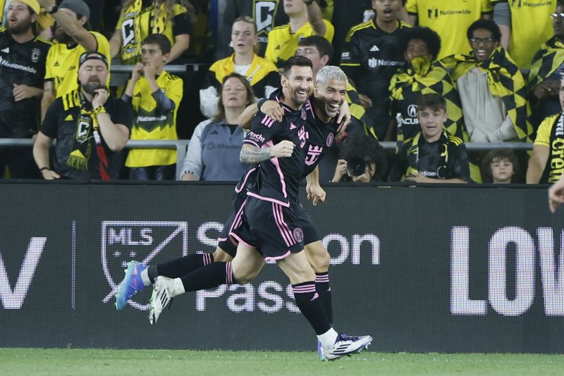 Inter Miami's Lionel Messi, left, and Luis Suarez celebrate their goal against the Columbus Crew during the second half of an MLS soccer match, Wednesday, Oct. 2, 2024, in Columbus, Ohio. (AP Photo/Jay LaPrete)