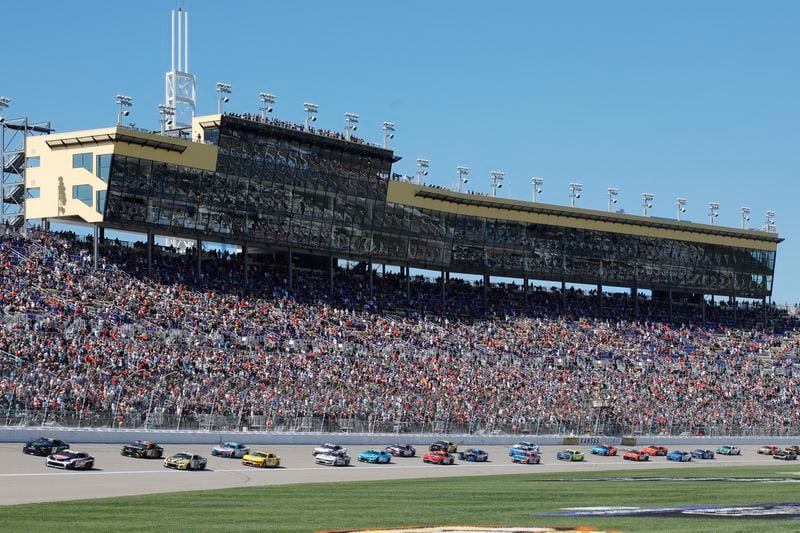 Drivers head toward Turn 1 during the start of a NASCAR Cup Series auto race at Kansas Speedway in Kansas City, Kan., Sunday, Sept. 29, 2024. (AP Photo/Colin E. Braley)