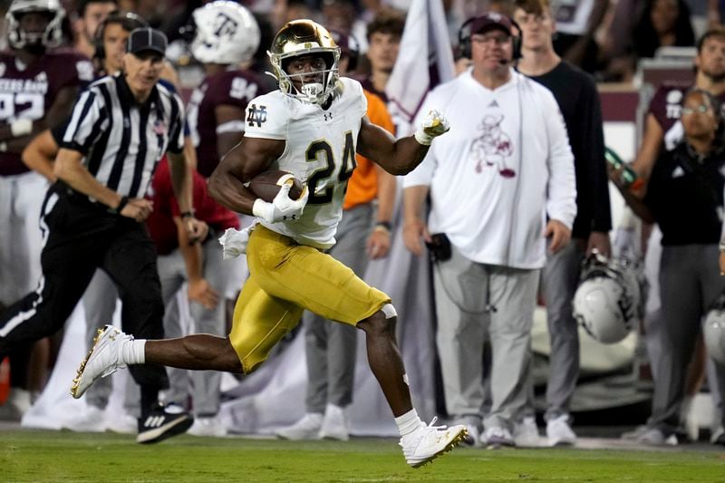 Notre Dame running back Jadarian Price (24) breaks free for a 47-yard touchdown run against Texas A&M during the third quarter of an NCAA college football game Saturday, Aug. 31, 2024, in College Station, Texas. (AP Photo/Sam Craft)