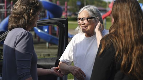 Sandra Hemme, center, meets with family and supporters after she was released from Chillicothe Correctional Center, Friday, July 19, 2024, in Chillicothe, Miss. Hemme's murder conviction was overturned after she served 43 years in prison, despite objections from Missouri’s attorney general. (HG Biggs/The Kansas City Star via AP)