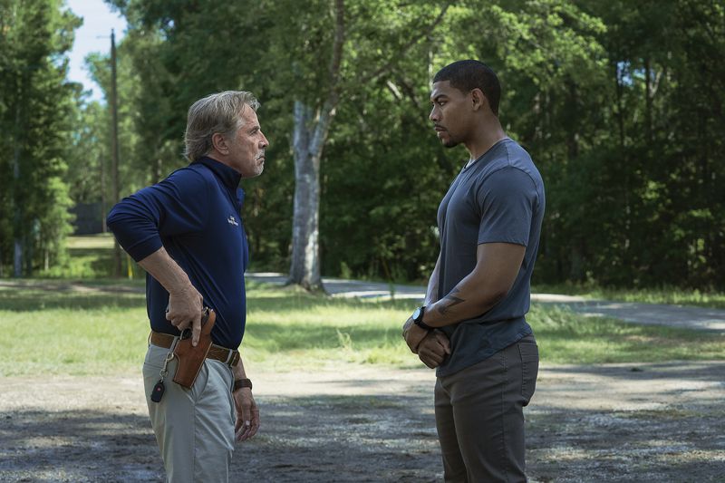 This image released by Netflix shows Don Johnson as Chief Sandy Burnne, left, and Aaron Pierre as Terry Richmond in a scene from "Rebel Ridge." (Allyson Riggs/Netflix via AP)