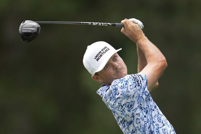 Luke Clanton hits from the fourth tee during the final round of the Rocket Mortgage Classic golf tournament at Detroit Country Club, Sunday, June 30, 2024, in Detroit. (AP Photo/Paul Sancya)