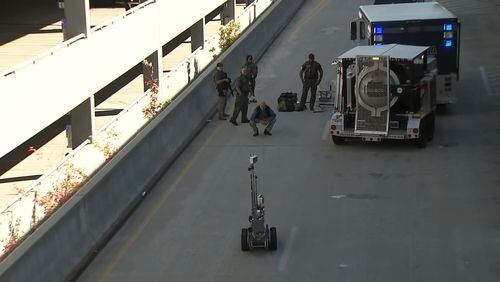 Crews investigate a suspicious package at the Atlanta airport Sunday morning.