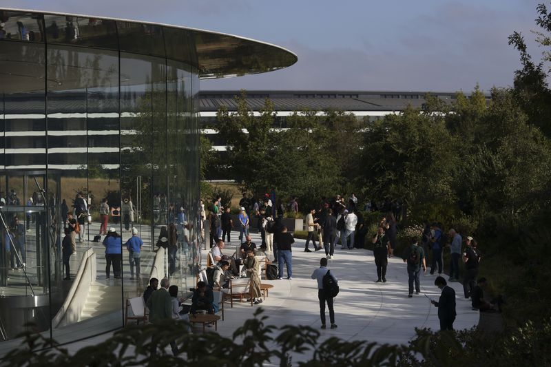 Attendees wait inside and outside the Steve Jobs Theater before an announcement of new products at Apple headquarters Monday, Sept. 9, 2024, in Cupertino, Calif. (AP Photo/Juliana Yamada)