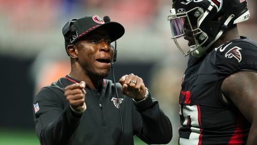 Atlanta Falcons head coach Raheem Morris talks with Atlanta Falcons defensive tackle Zion Logue during their preseason NFL game against the Jacksonville Jaguars at Mercedes-Benz Stadium, on Friday, Aug. 23, 2024, in Atlanta. The Falcons lost 31-0. (Jason Getz / AJC)
