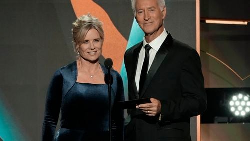 FILE - Mary Beth Evans, left, and Drake Hogestyn present the award for outstanding daytime talk series host during the 50th Daytime Emmy Awards on Friday, Dec. 15, 2023, in Los Angeles. Hogestyn, who played John Black for nearly four decades, has died from pancreatic cancer at age 70. (AP Photo/Chris Pizzello, File)