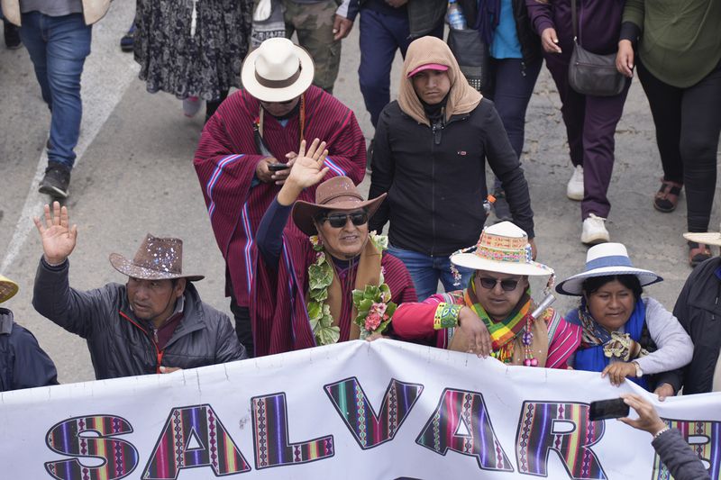 Former President Evo Morales, center, marches to the capital to protest the government of current President Luis Arce, near El Alto, Bolivia, Sunday, Sept. 22, 2024. (AP Photo/Juan Karita)