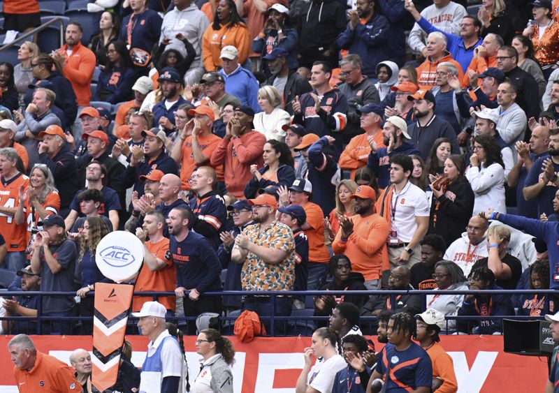 Syracuse fans cheer during the second half of an NCAA football game against Georgia Tech, Saturday, Sept. 7, 2024 in Syracuse, N.Y. Syracuse won 31-28. (AP Photo/Hans Pennink)