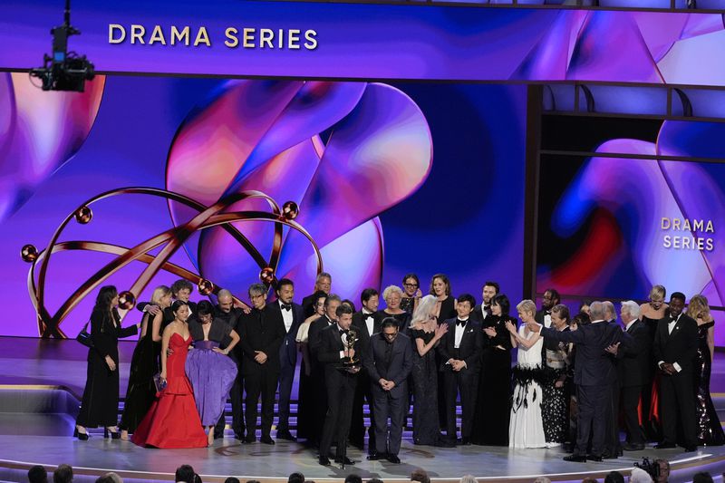 Justin Marks, left center, and Hiroyuki Sanada, center right, and the team from "Shogun" accepts the award for outstanding drama series during the 76th Primetime Emmy Awards on Sunday, Sept. 15, 2024, at the Peacock Theater in Los Angeles. (AP Photo/Chris Pizzello)