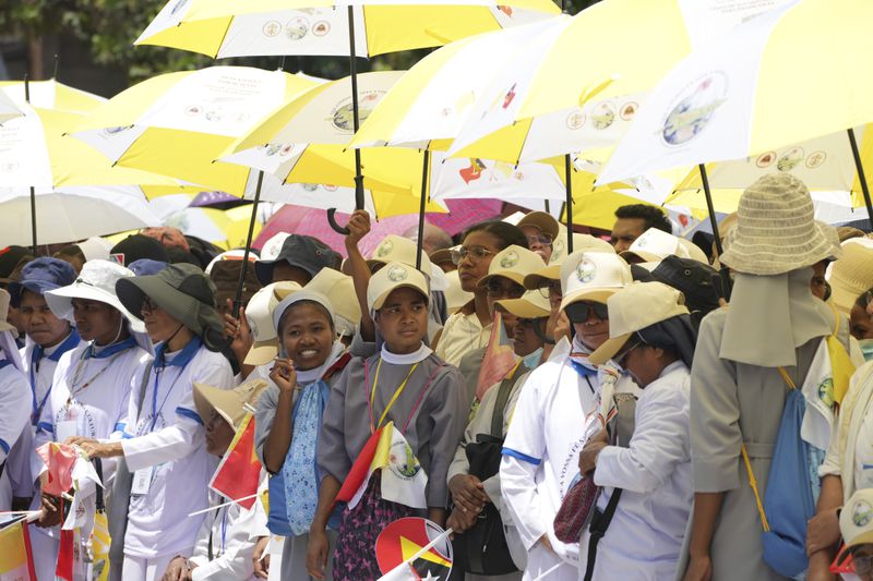 Nuns wait Pope Francis' arrival outside of the Dili Presidente Nicolau Lobato International Airport in Dili, East Timor, Monday, Sept. 9, 2024. (AP Photo/Firdia Lisnawati)