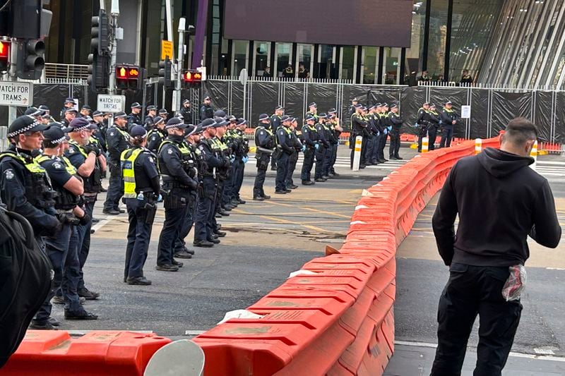 Victoria Police man barricades outside a military arms convention in downtown Melbourne, Australia, Wednesday, Sept. 11, 2024. (AP Photo/Rod McGuirk)