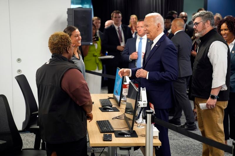 President Joe Biden greets people during a visit to the D.C. Emergency Operations Center, Tuesday, July 2, 2024, in Washington. (AP Photo/Evan Vucci)