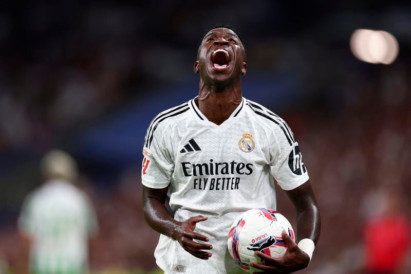 Real Madrid's Vinicius Junior reacts during the Spanish La Liga soccer match between Real Madrid and Betis at the Santiago Bernabeu stadium in Madrid, Spain, Sunday, Sept. 1, 2024. (AP Photo/Pablo Garcia)