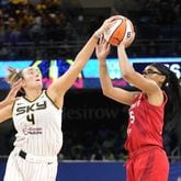 Chicago Sky's Marina Mabrey, left, blocks the shot of Atlanta Dream's Allisha Gray in the closing seconds of a WNBA basketball game Wednesday, July 10, 2024, in Chicago. The Sky won 78-69. (AP Photo/Charles Rex Arbogast)