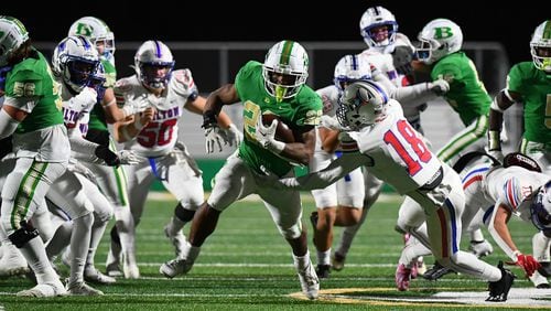 Justice Haynes, running back for Buford, runs the ball down for a touchdown during the Walton vs. Buford High School Football game on Friday, Nov. 18, 2022, at Buford High School in Buford, Georgia. (Jamie Spaar for the Atlanta Journal Constitution)