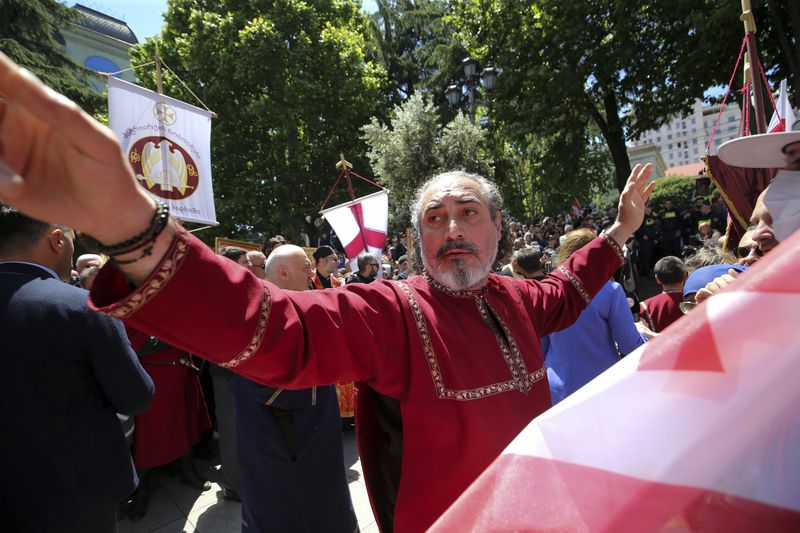 FILE - A Georgian Orthodox Church clergyman attends a celebration of the Day of Family Purity in the conservative country where animosity toward LGBTQ+ people is strong, in Tbilisi, Georgia, on May 17, 2024. (AP Photo/Zurab Tsertsvadze, File)