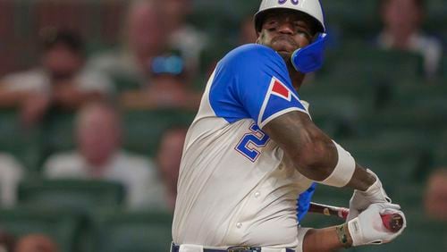 Atlanta Braves' Jorge Soler (2) misses a pitch in the ninth inning of a baseball game against the Miami Marlins, Saturday, Aug. 3, 2024, in Atlanta. The Braves lost 4-3. (AP Photo/Jason Allen)