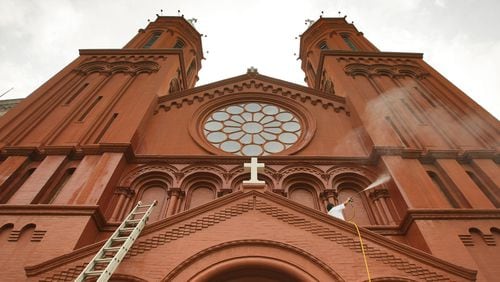 FILE: The Basilica of the Sacred Heart of Jesus on Peachtree Street in Downtown Atlanta is known for its twin towers and red brick. (Photo Courtesy of John Spink/The Atlanta Journal-Constitution)