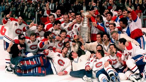 FILE - The Montreal Canadiens pose for a photograph with the Stanley Cup following their 4-1 victory over the Los Angeles Kings, June 9, 1993, in Montreal. It has been 31 years since an NHL team based in Canada won the Stanley Cup — a drought the Edmonton Oilers can end by winning Game 7 at the Florida Panthers on Monday, June 24, 2024. (Frank Gunn/The Canadian Press via AP, File)