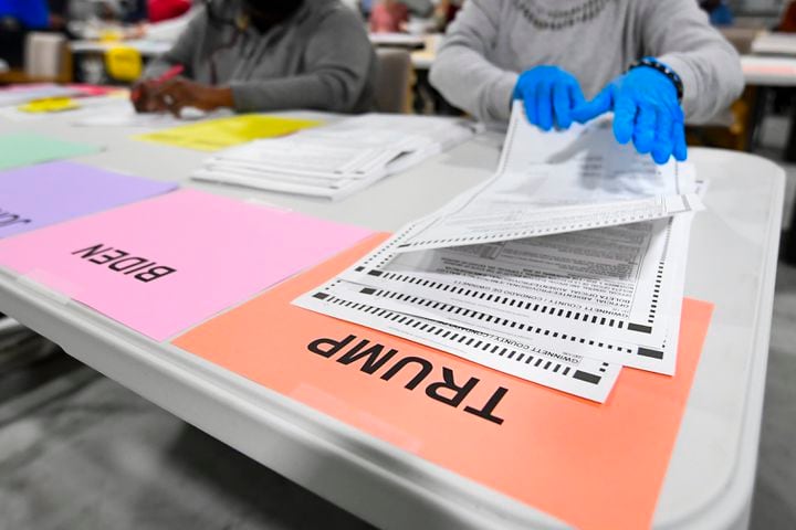 President Trump has a ballot put in his column as votes for President are recounted at the Gwinnett County elections office on Friday, Nov.13, 2020 in Lawrenceville. (JOHN AMIS FOR THE ATLANTA JOURNAL-CONSTITUTION)