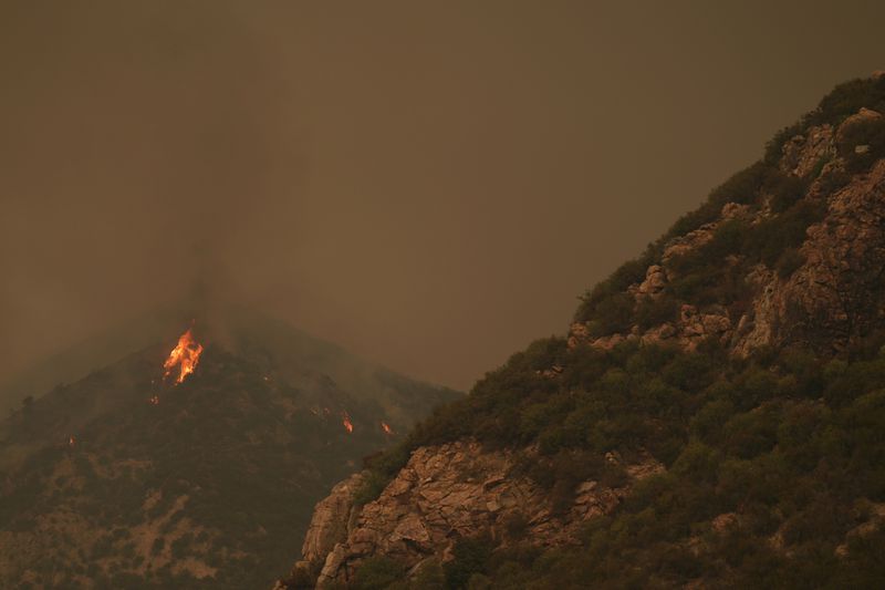 The Line Fire burns in the mountains Monday, Sept. 9, 2024, near Forest Falls, Calif. (AP Photo/Eric Thayer)