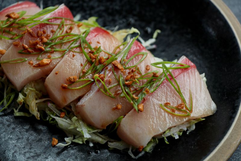 The hamachi sunomono from Mujo is a dish that both connoisseurs and sushi novices will enjoy. Photo Credit: Emily Blackwood/Mujo