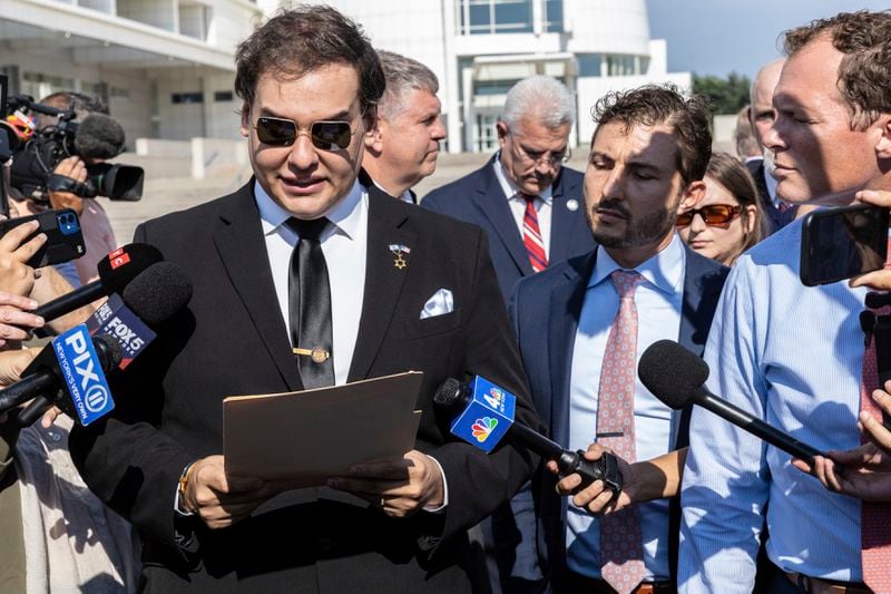 Former U.S. Rep George Santos speaks to the media outside the federal courthouse in Central Islip, N.Y. on, Monday, Aug. 19, 2024 in New York. (AP Photo/Stefan Jeremiah)