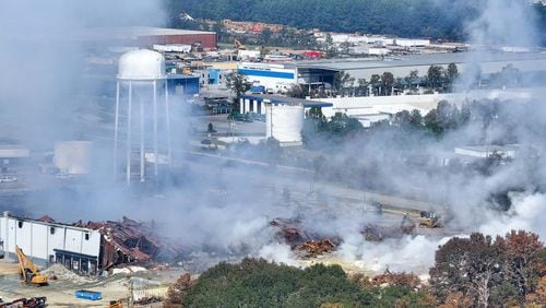 This aerial view, taken on the side of I-20, shows smoke traveling west from the Biolab facility in Conyers on Thursday.
(Miguel Martinez / AJC)