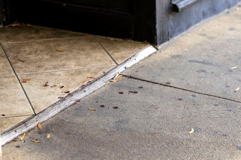 Drops of blood remain at the scene of a fatal Saturday night shooting in the Five Points neighborhood of Birmingham, Ala., Sunday, Sept. 22, 2024. (AP Photo/Vasha Hunt)