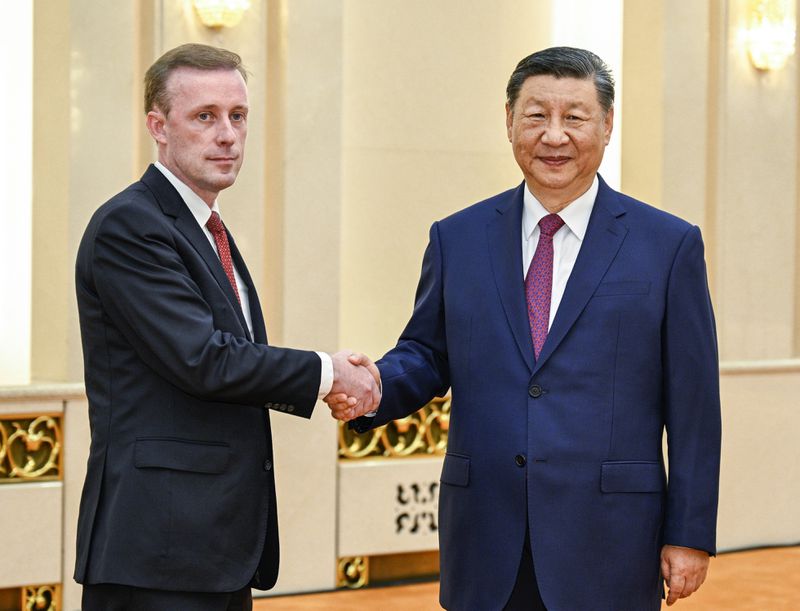 In this photo released by Xinhua News Agency, Chinese President Xi Jinping, right, meets with White House national security adviser Jake Sullivan at the Great Hall of the People in Beijing, capital of China, Thursday, Aug. 29, 2024. (Li Xueren/Xinhua via AP)