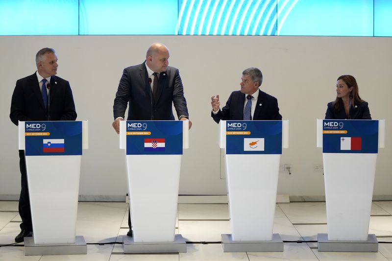 Cypriot Minister of Energy George Papanastasiou, center right, talks with his counterparts of Malta Miriam Dalli, right, Slovenia Bojan Kumer, left, and Croatia Economy Minister Ante Susnjar, center left, during a press conference after the MED9 Energy Ministerial Meeting in southern coastal city of Larnaca, Cyprus, Monday, Sept. 23, 2024. (AP Photo/Petros Karadjias)