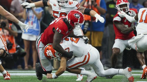 Georgia defensive lineman Mykel Williams (13) sacks Clemson quarterback Cade Klubnik (2) during the second half at Mercedes-Benz Stadium, on Saturday, Aug. 31, 2024, in Atlanta. Georgia won 34-3. (Jason Getz / AJC)
