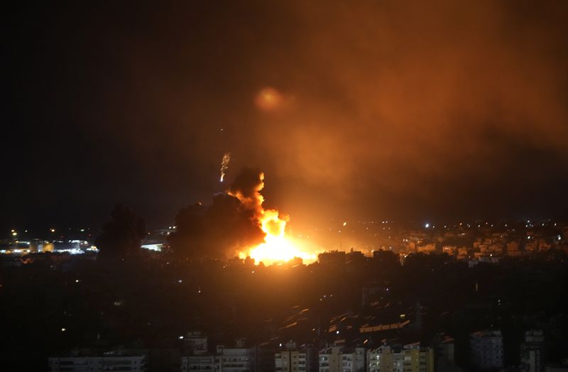 Flames rise from Israeli airstrikes in Dahiyeh, Beirut, Lebanon, Friday, Oct. 4, 2024. (AP Photo/Hussein Malla)