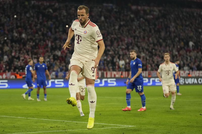 Bayern's Harry Kane celebrates after scoring the opening goal from the penalty sport during the Champions League opening phase soccer match between Bayern Munich and GNK Dinamo at the Allianz Arena in Munich, Germany Tuesday, Sept. 17, 2024. (AP Photo/Matthias Schrader)